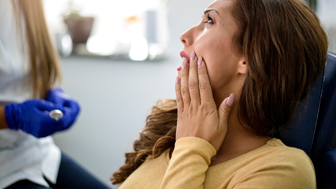 Pointing to the temporomandibular joint (TMJ) on a model school